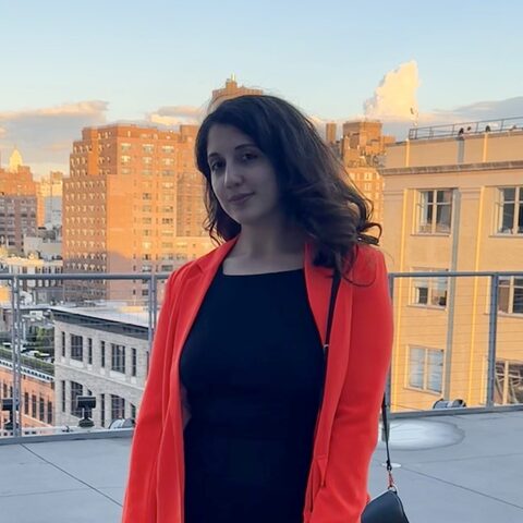 Ozlem Yildiz on a rooftop in Manhattan at sunset